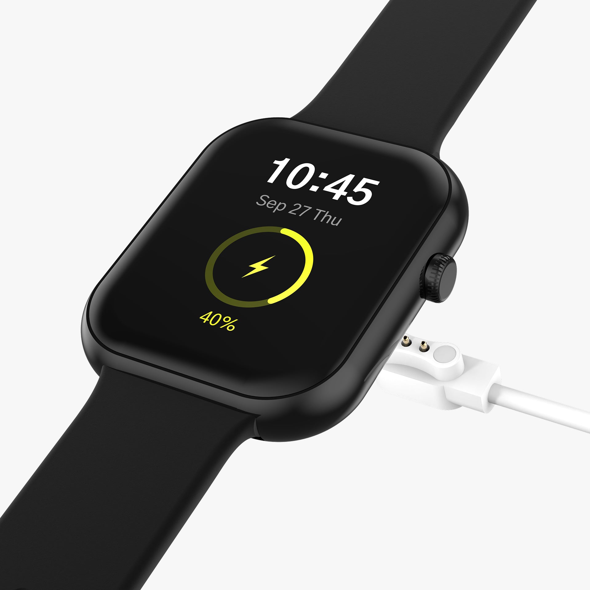 Black smartwatch with a charging cable on a white background